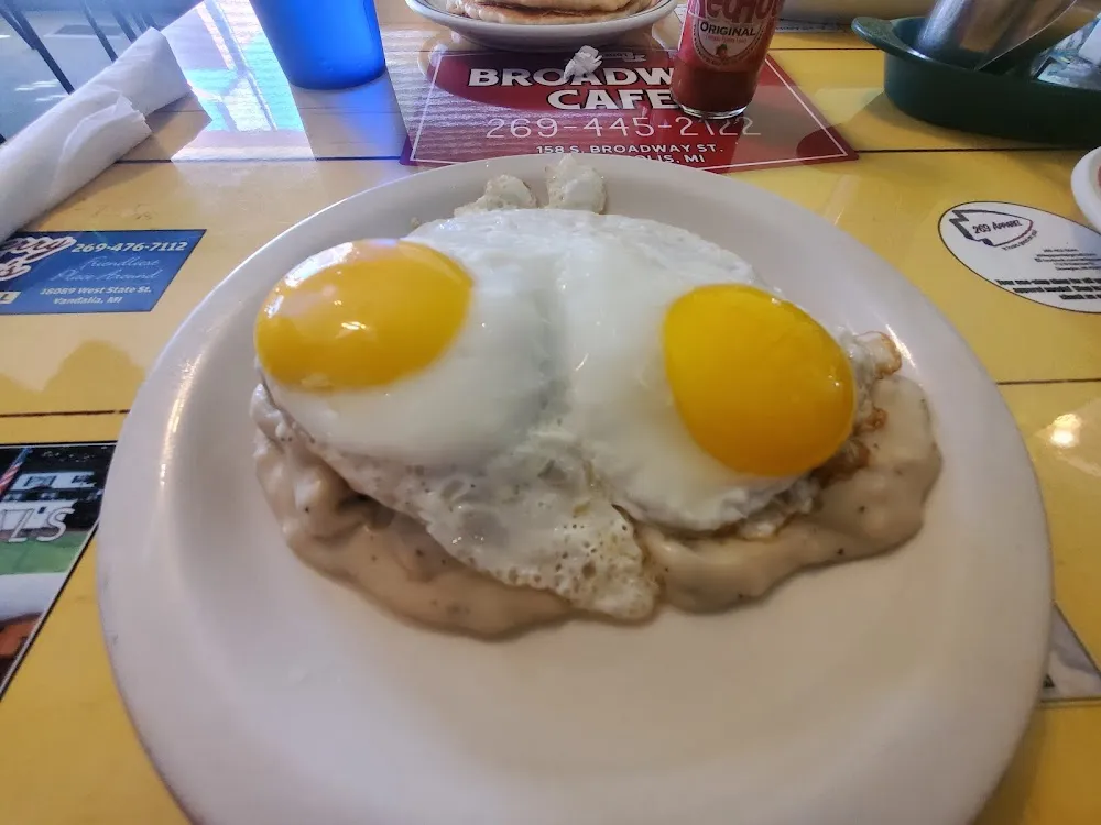 2 Sunnyside Up Eggs over Biscuits and Sausage Gravy
